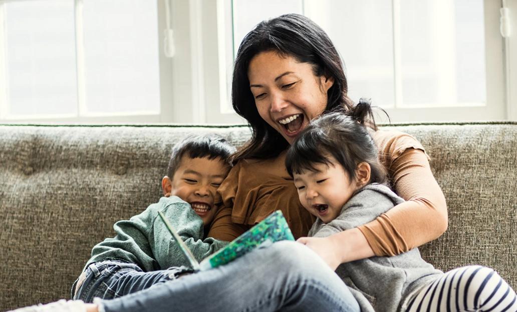 Woman reading to children