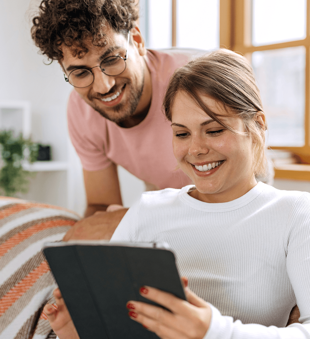 Man and woman looking at tablet