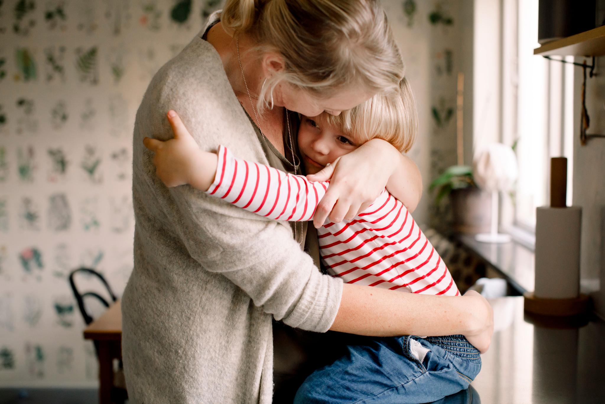 Woman holding her child