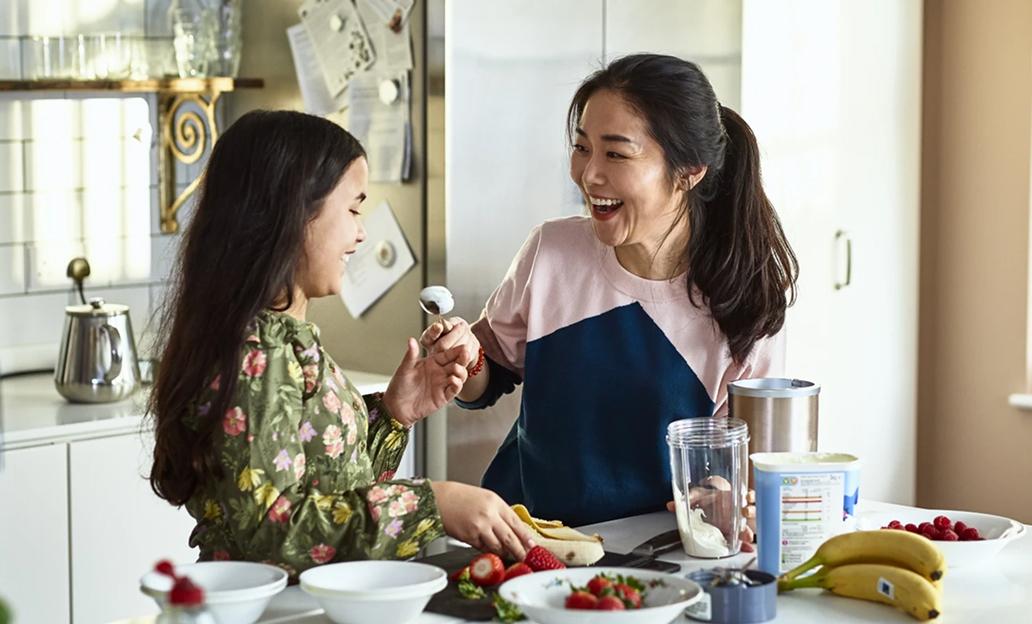 Mother and daughter cooking