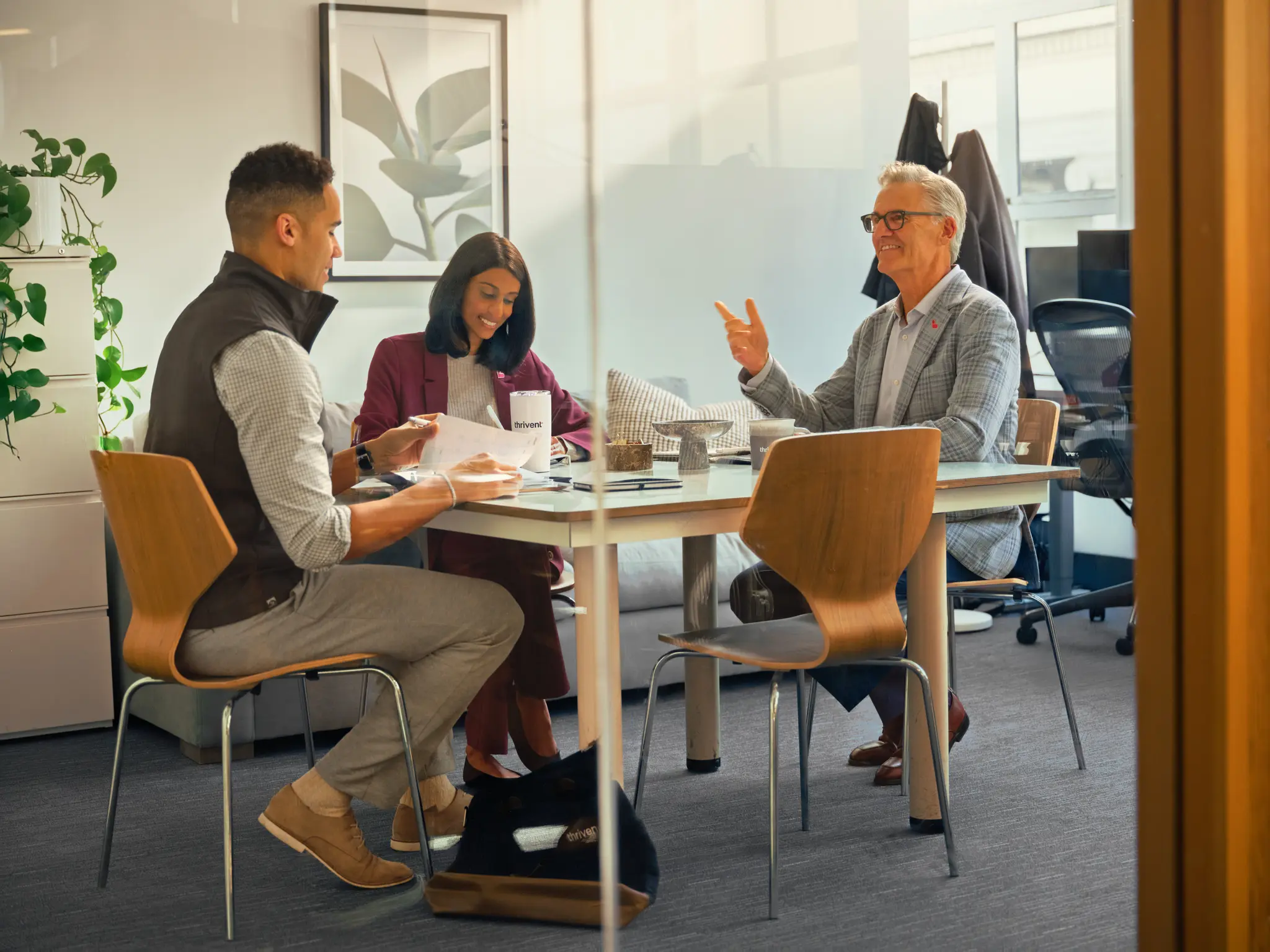 client speaking with smiling advisors